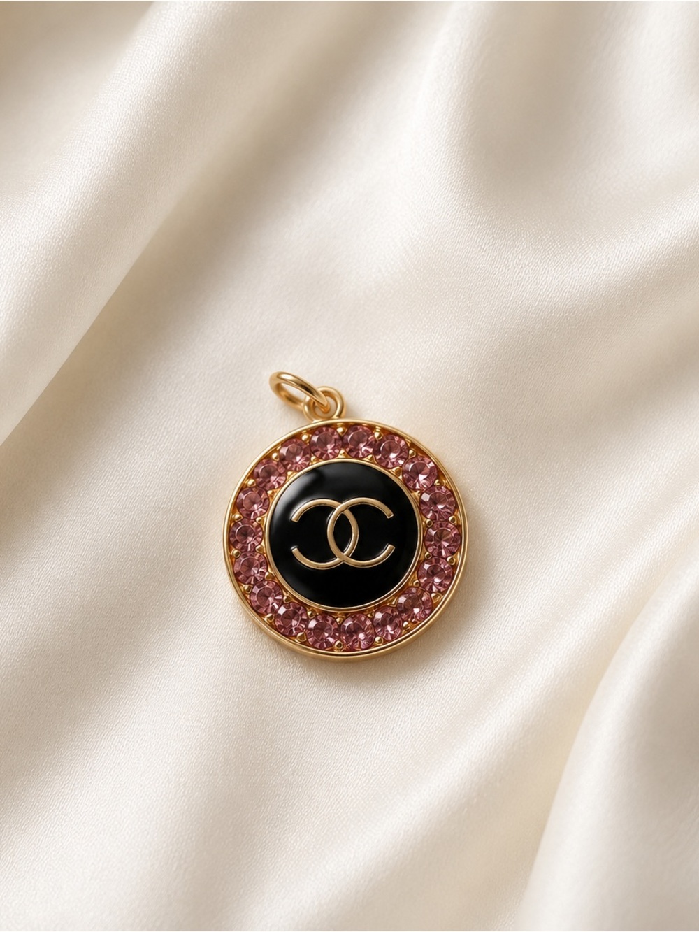 CHANEL Gold-Tone Pendant with Black Enamel and Pink Crystal Halo